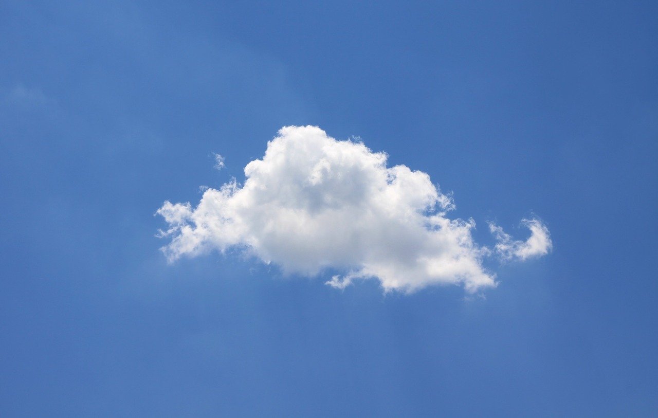 A single cloud against a blue sky